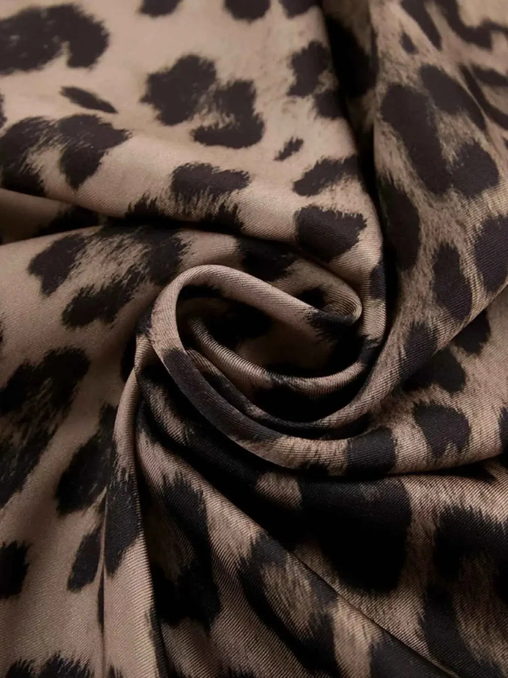 Leopard Print Maxi Skirt fabric in beige and black polyester with classic leopard patterns and soft texture detail
