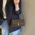 Leopard Print Shoulder Bag in small size with brown suede material and leopard pattern featuring a gold clasp and single shoulder strap