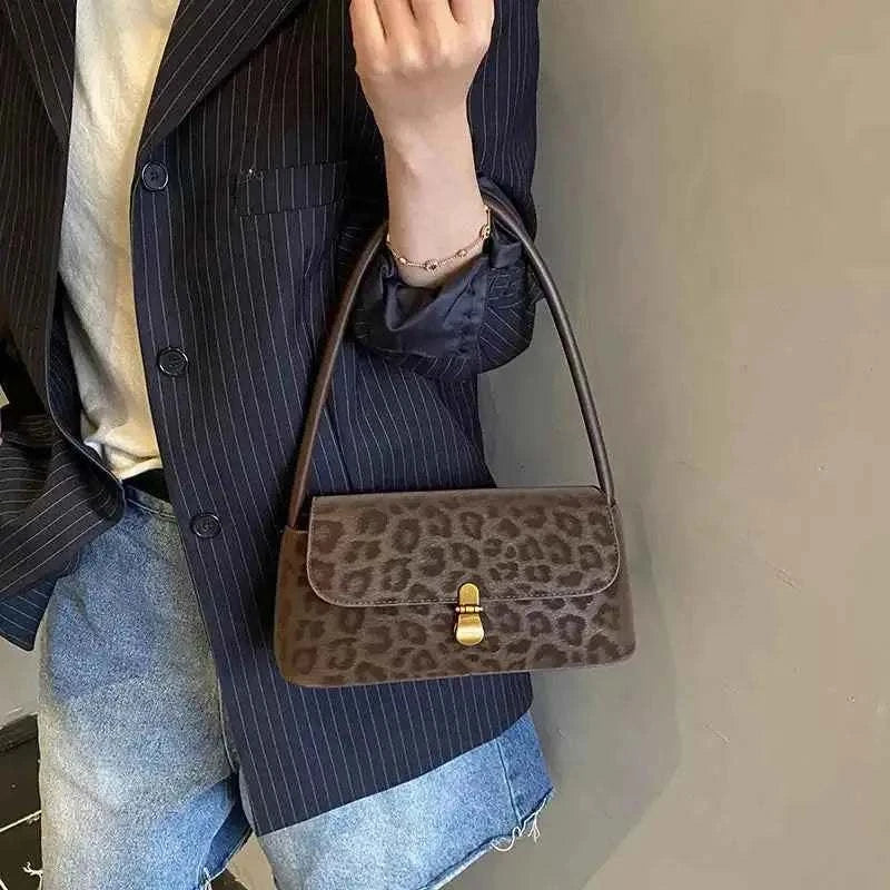 Leopard Print Shoulder Bag in small size with brown suede material and leopard pattern featuring a gold clasp and single shoulder strap