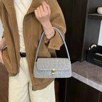 Leopard Print Shoulder Bag in light gray suede with subtle leopard spots, small rectangular shape and gold-tone clasp
