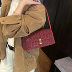 Leopard Print Shoulder Bag in small size with maroon suede material and subtle leopard pattern with gold-tone clasp