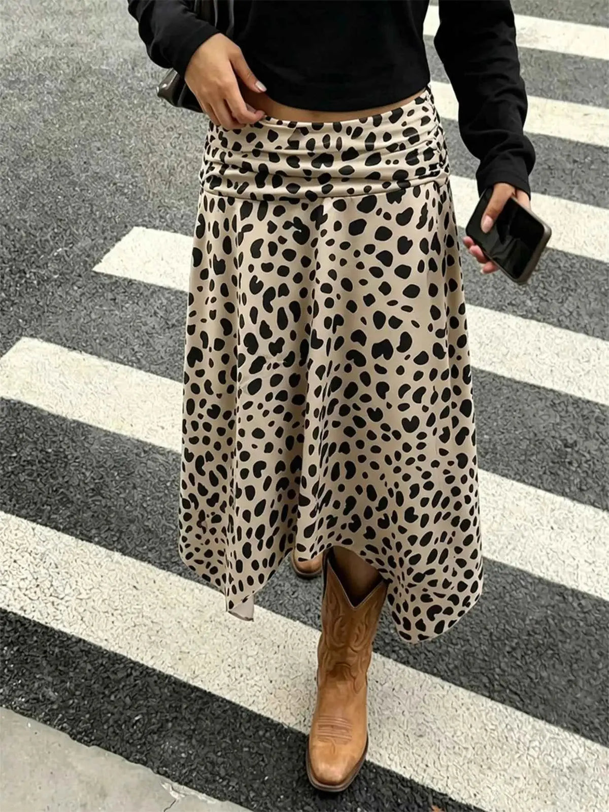 Leopard Print Skirt with asymmetrical hem in beige polyester featuring black spotted pattern and ruched detailing
