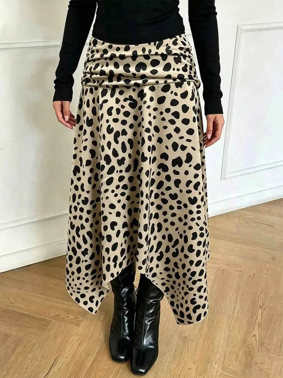 Leopard Print Skirt with beige base and black spots, asymmetrical hem and ruched detailing on polyester fabric