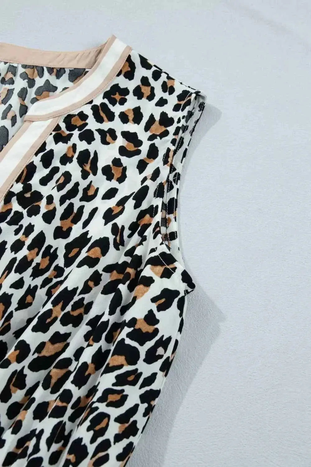 Leopard Print sleeveless midi dress with beige colorblock trim and tiered polyester fabric