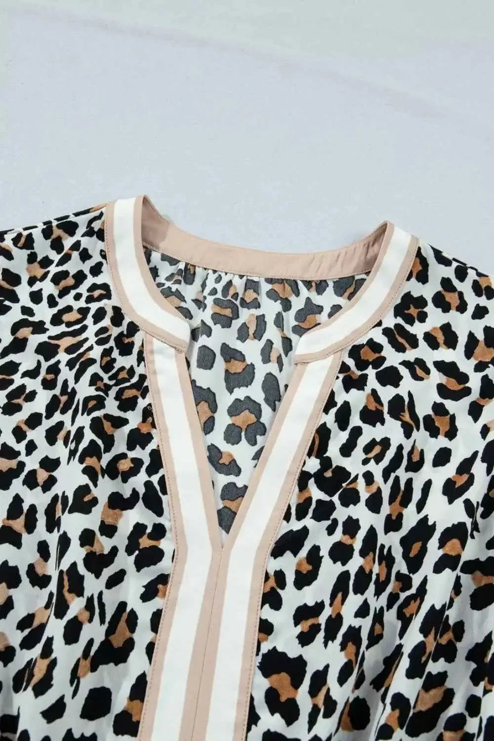 Leopard Print sleeveless midi dress with beige colorblock trim and tiered polyester fabric, no stretch or lining