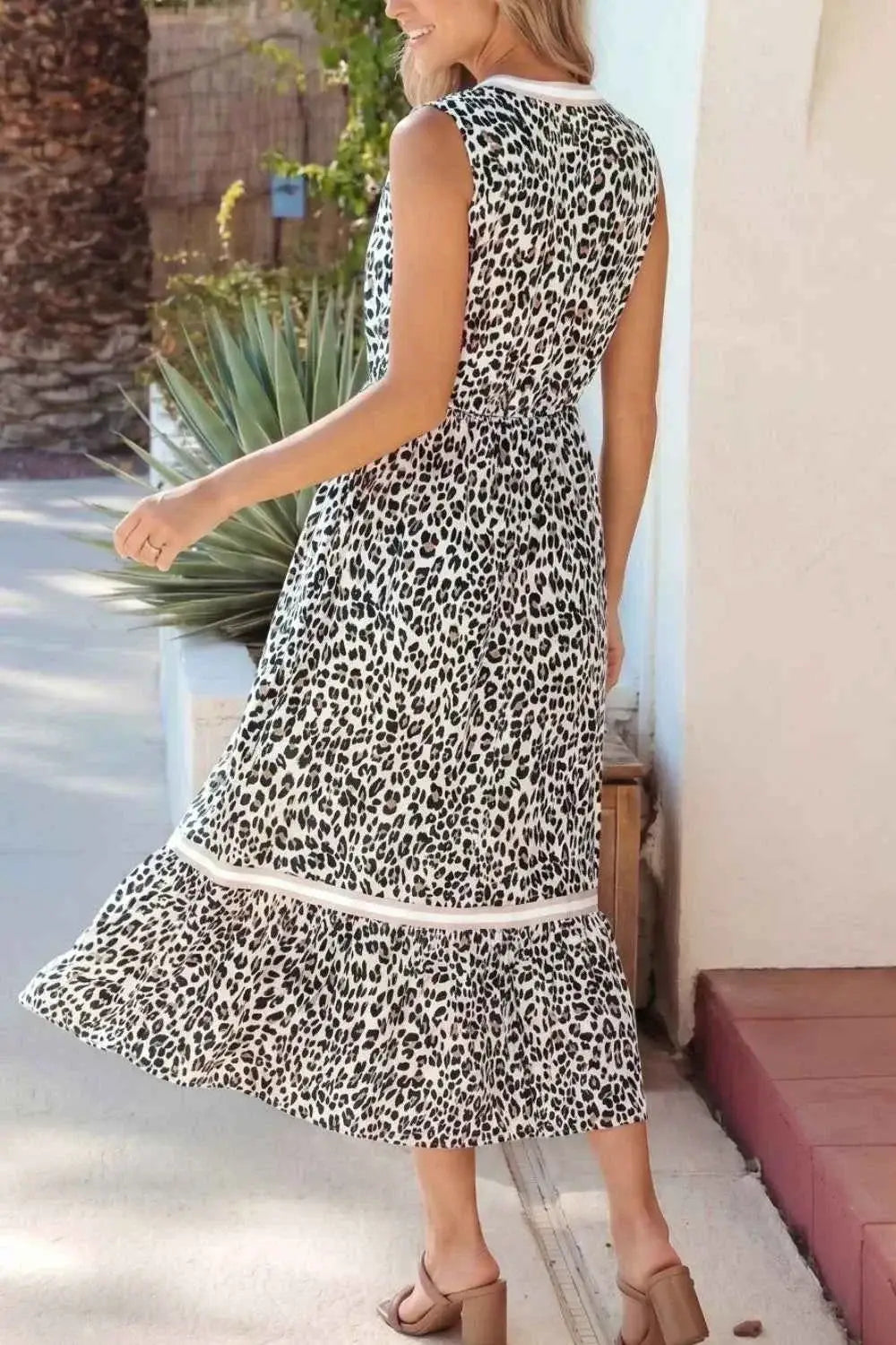 Leopard Print sleeveless midi dress with colorblock trim and tiered skirt in black and white polyester fabric