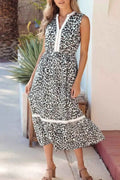 Leopard Print sleeveless midi dress with tiered skirt and colorblock trim in black and white polyester fabric