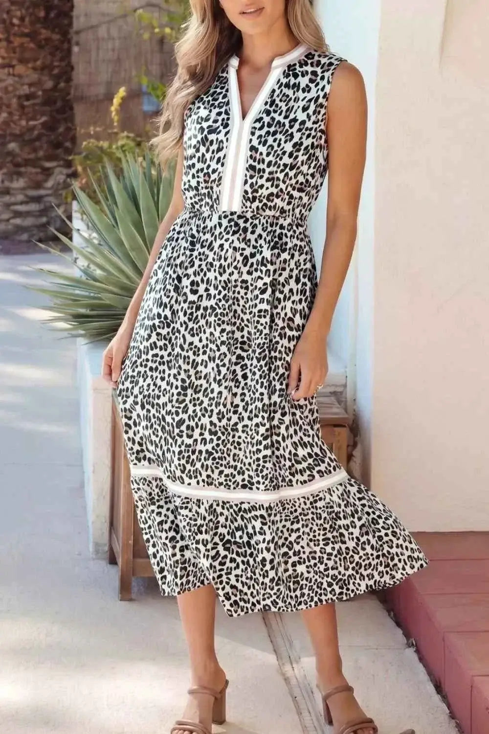 Leopard Print sleeveless midi dress with tiered skirt and colorblock trim in black and white polyester fabric