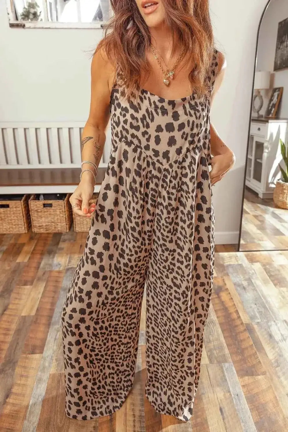 Leopard Print sleeveless jumpsuit with square neck and pleated wide legs in brown and black leopard pattern