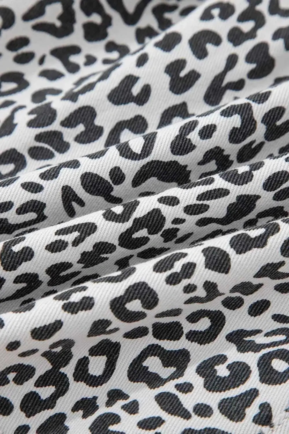Leopard Print Tassel fabric in black and white with a soft textured pattern on cotton polyester material