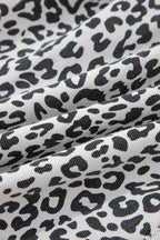 Leopard Print Tassel fabric in black and white with a soft textured pattern on cotton polyester material