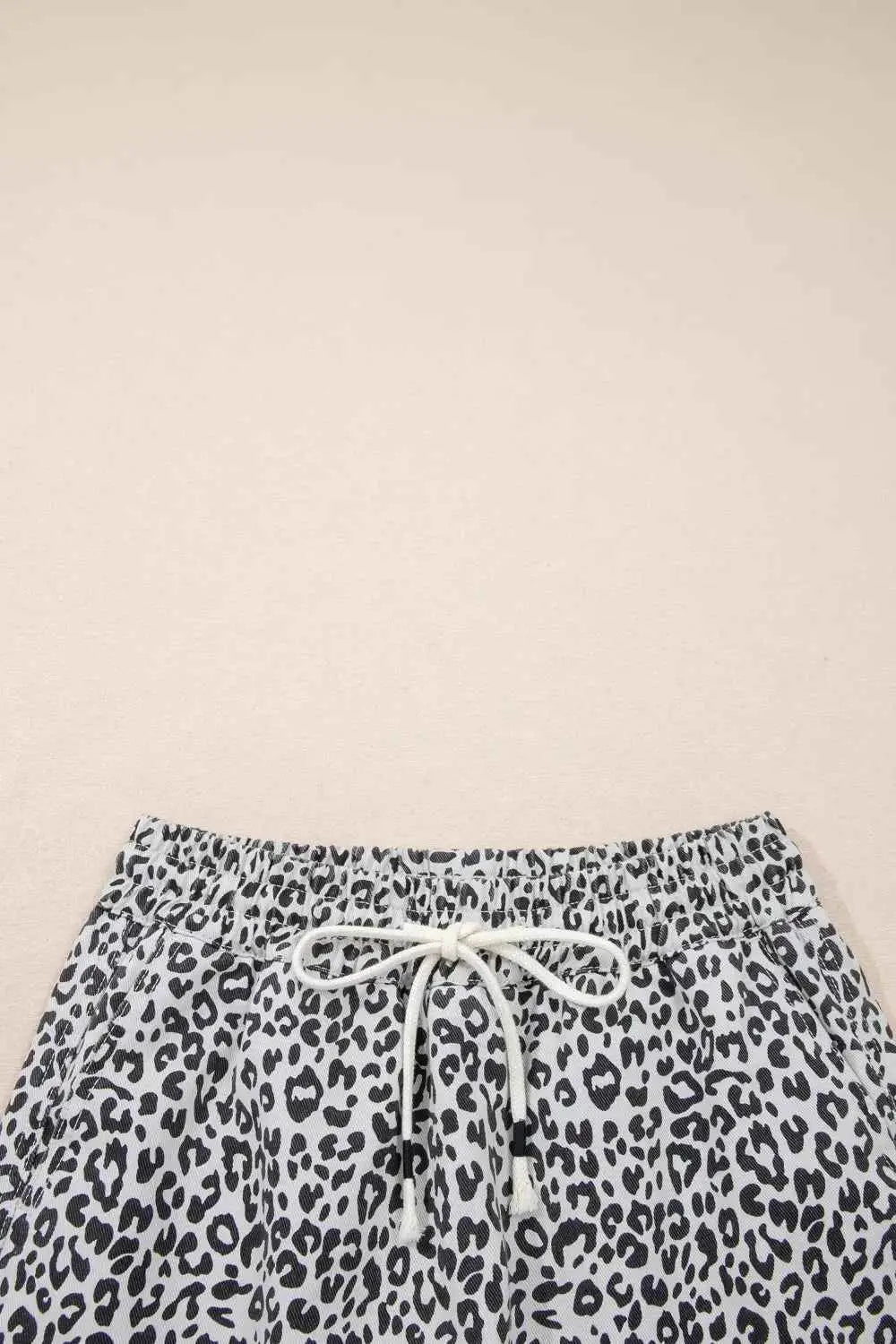 Leopard Print Tassel drawstring casual denim skort in black and white with pocketed sides and a front tie