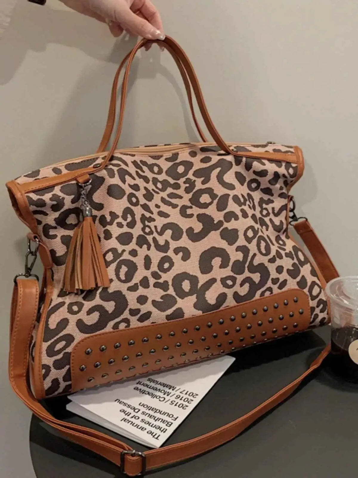 Leopard Studded Tote Bag in brown and black leopard print PU leather with studded base and tassel detail