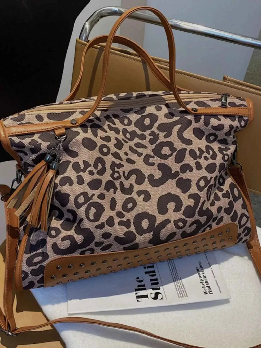 Leopard Studded Tote Bag in brown and tan PU leather with leopard print and decorative tassel detailing