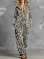 Leopard Zip-Front Hooded Jumpsuit in grey with black and orange spots, featuring a front zipper, pockets, and a drawstring hood