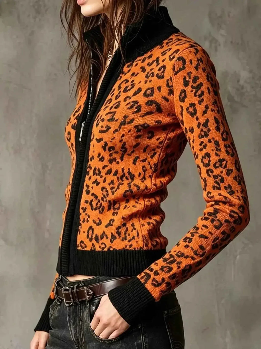 Leopard Zip-Up knit cardigan in orange and black with ribbed cuffs and hem, featuring a leopard pattern and front zipper