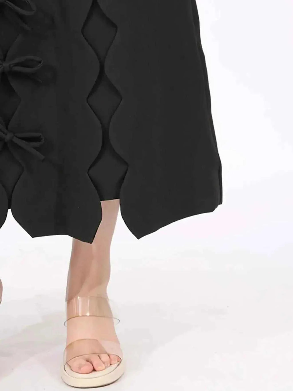Long Sleeve Bow Front black midi dress with scalloped hem and bow details on side, polyester fabric