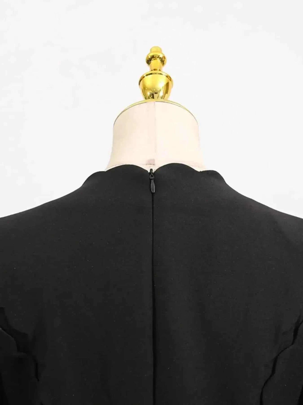 Long Sleeve Bow Front black midi dress with scalloped edge neckline and back zipper closure on mannequin