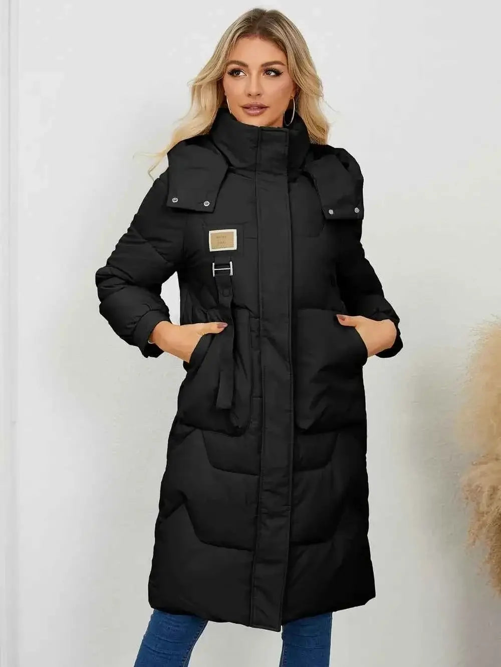 Long Sleeve Longline Hooded Winter Coat in black polyester with front pockets and a high collar, quilted design
