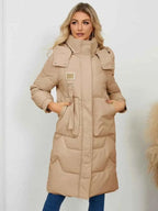 Long Sleeve Longline Hooded Winter Coat in beige polyester with quilted pattern, high collar, and front pockets