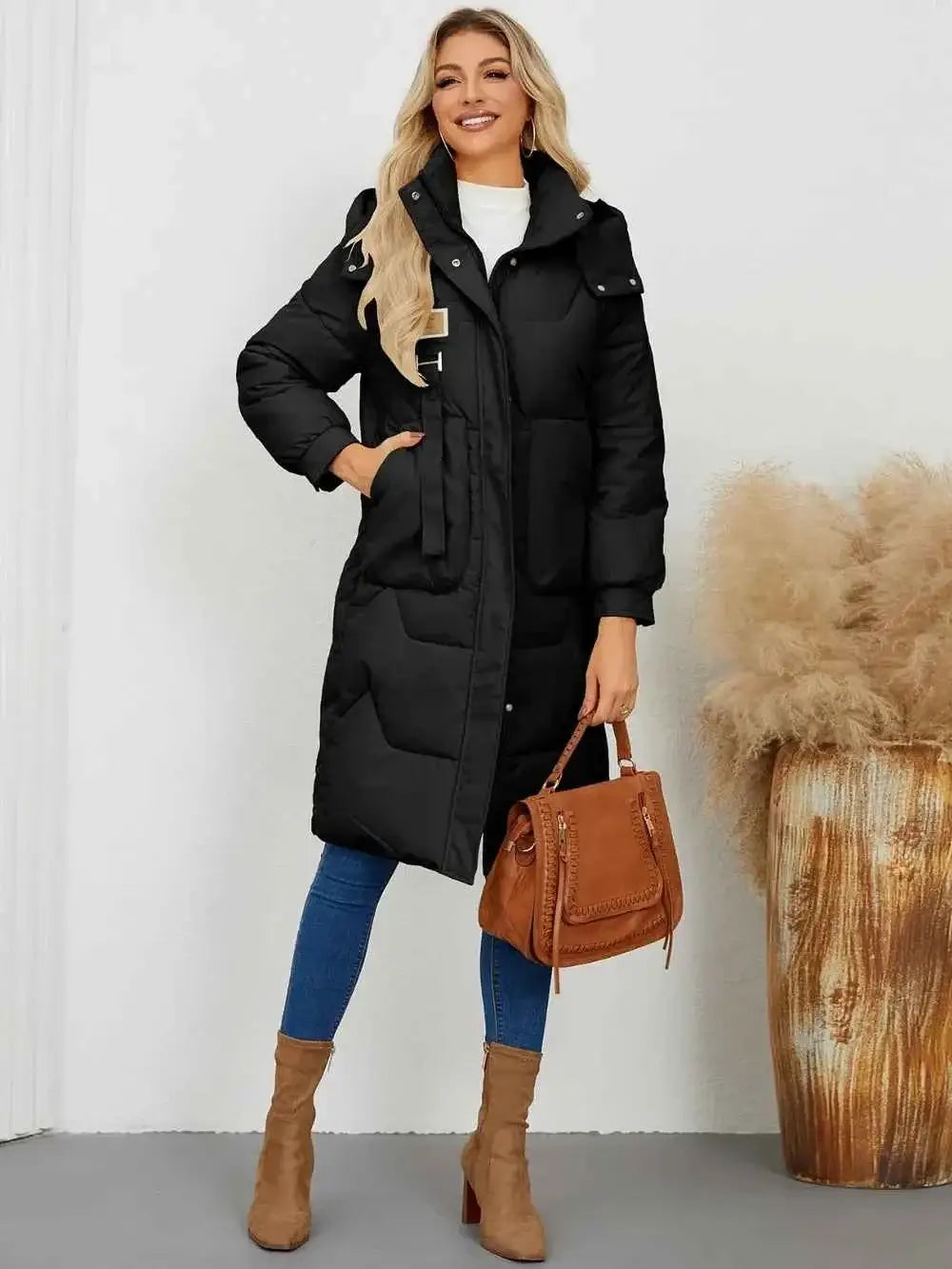 Long Sleeve Longline Hooded Winter Coat in black polyester with front pockets and button details, worn by a smiling woman