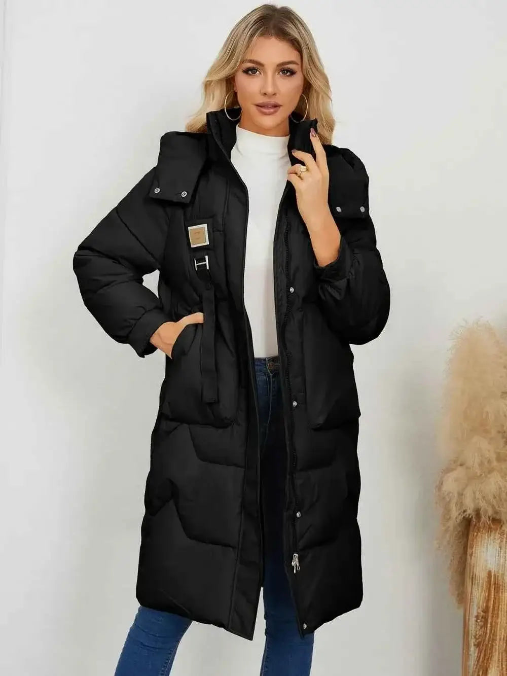 Long Sleeve Longline Hooded Winter Coat in black polyester with front pockets and button details worn by model