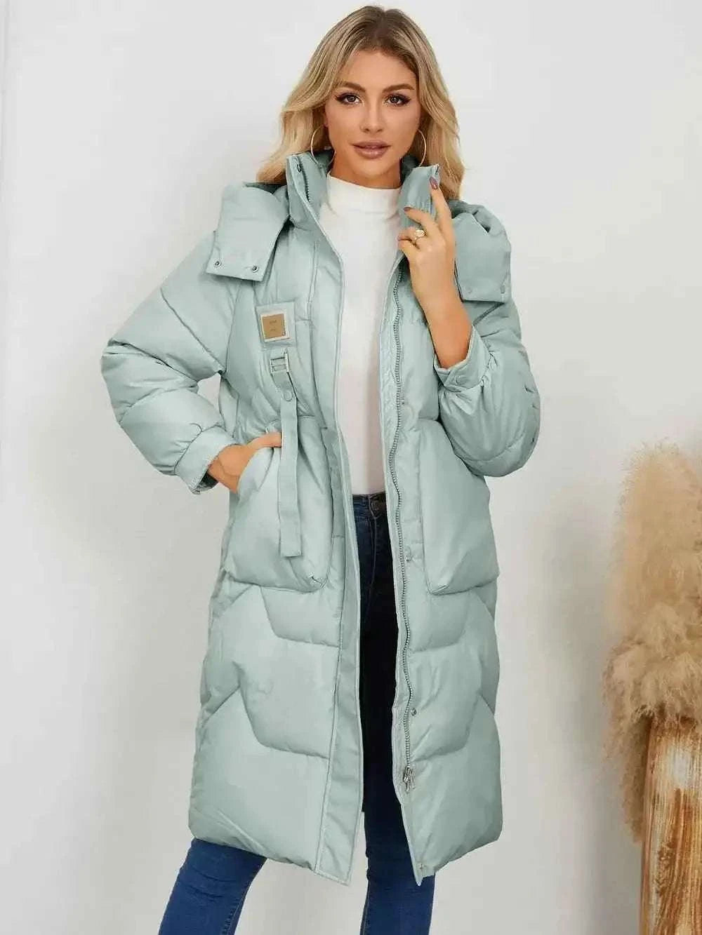 Long Sleeve Longline Hooded Winter Coat in light blue polyester with padded insulation, side pockets, and front zipper closure