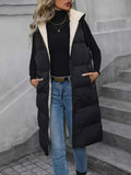 Longline padded hooded vest in black polyester with front pockets and zipper closure, sleeveless and body lined