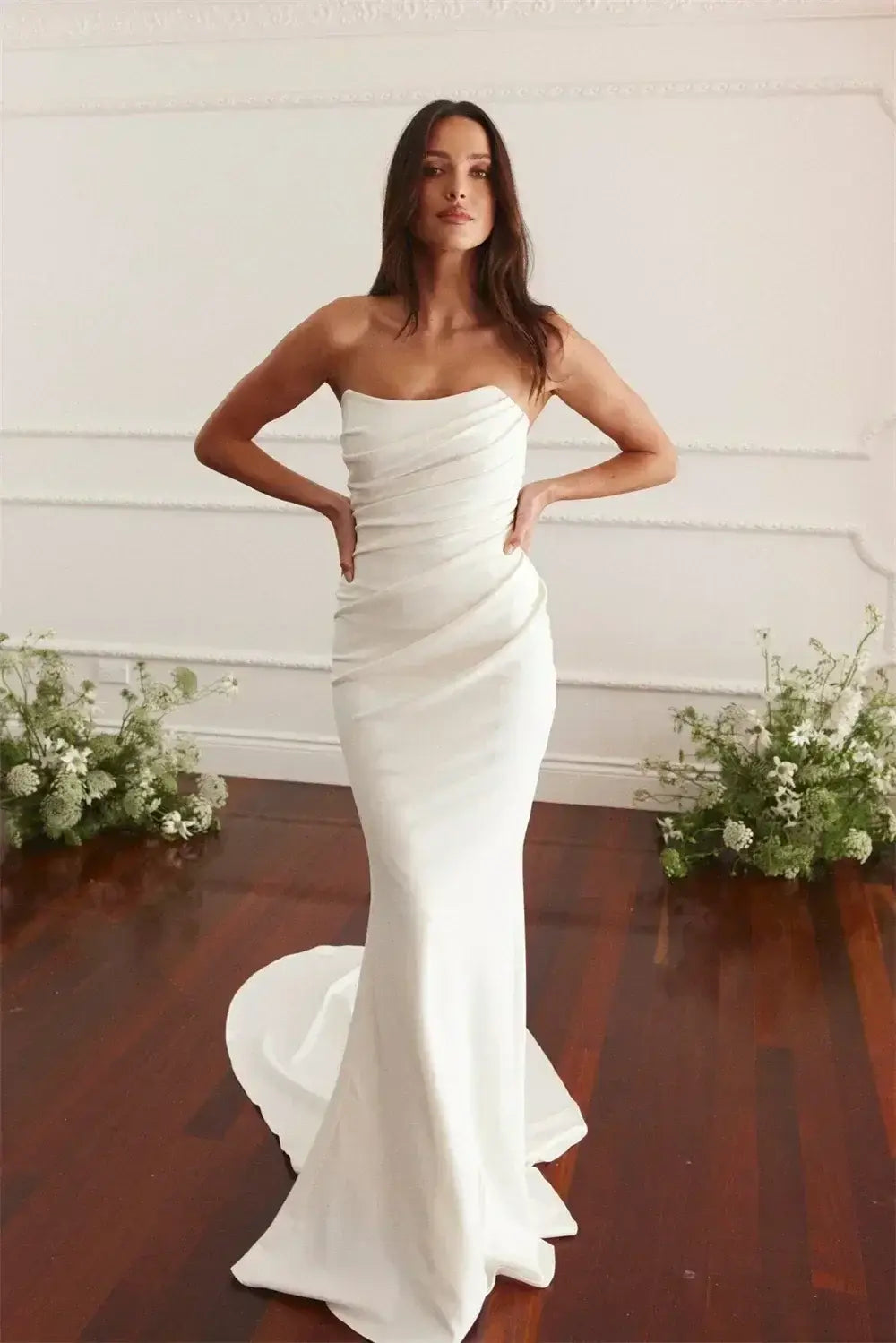 Maternity Mermaid Wedding Dress in white silk satin with strapless neckline and fitted mermaid silhouette featuring a sweep train