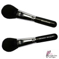 Mineral Powder Brush with black fluffy dome-shaped bristles and sleek black handle, featuring shiny silver ferrule for smooth application