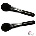Mineral Powder Brush with black fluffy dome-shaped bristles and sleek black handle, featuring shiny silver ferrule for smooth application
