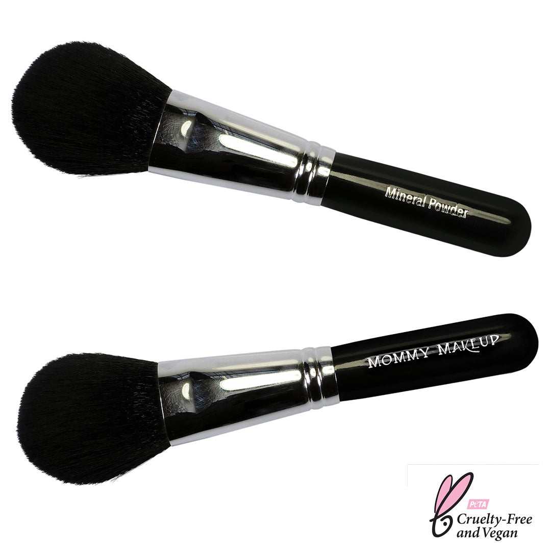 Mineral Powder Brush with black fluffy dome-shaped bristles and sleek black handle, featuring shiny silver ferrule for smooth application