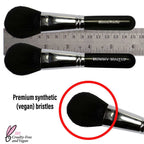 Mineral Powder Brush with black vegan synthetic bristles, full fluffy dome head, and black handle for smooth blending