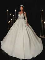 Modern Wedding Dresses white A-line bridal gown with lace appliques, full sleeves, V-neckline, and floor-length skirt