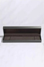 Empty rectangular jewelry box with dark exterior and soft brown velvet interior suitable for a Moissanite Bracelet