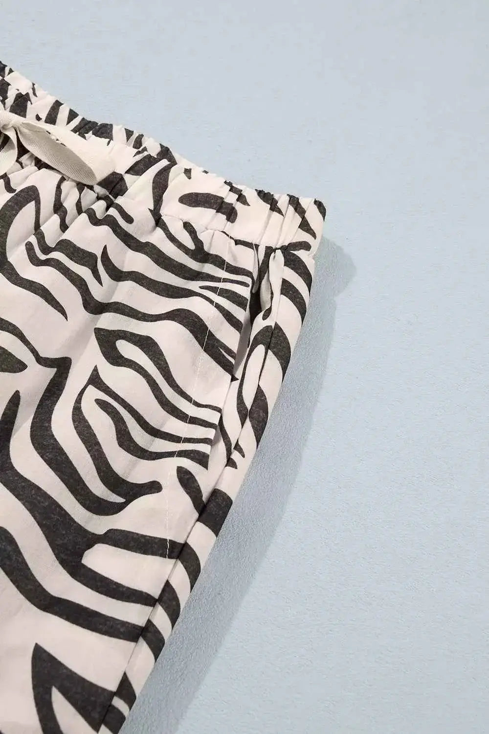 Multicolour Western Print elastic waist pants with black and white zebra pattern and side pocket detail