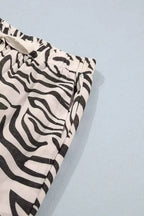 Multicolour Western Print elastic waist pants with black and white zebra pattern and side pocket detail
