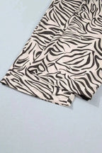 Multicolour Western Print polyester pants featuring black and white zebra pattern with elastic waistband and visible pocket