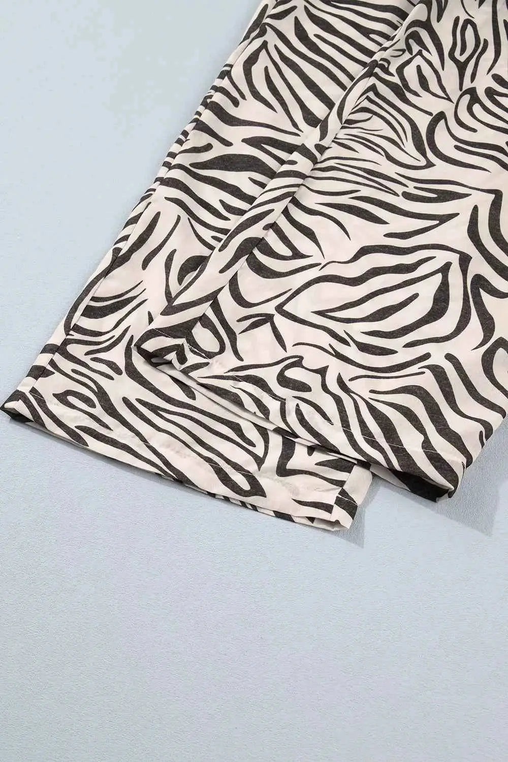 Multicolour Western Print polyester pants featuring black and white zebra pattern with elastic waistband and visible pocket