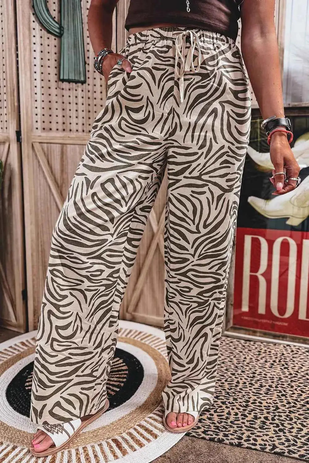 Multicolour Western Print wide-leg pants with elastic drawstring waist and zebra pattern in beige and black tones
