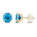Natural Swiss Blue Topaz stud earrings featuring round brilliant blue gemstones set in 14K yellow gold with four-prong settings and push-back closures