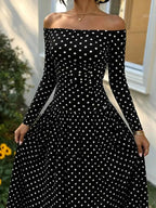 Off-the-Shoulder Maxi Dress in black with white polka dots, long sleeves, and a fitted bodice with a flowing skirt design.