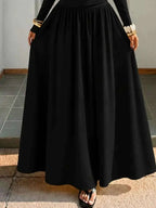 Off-the-Shoulder Maxi Dress in black with a fluid, full-length silhouette and lightweight fabric flowing elegantly to the floor.