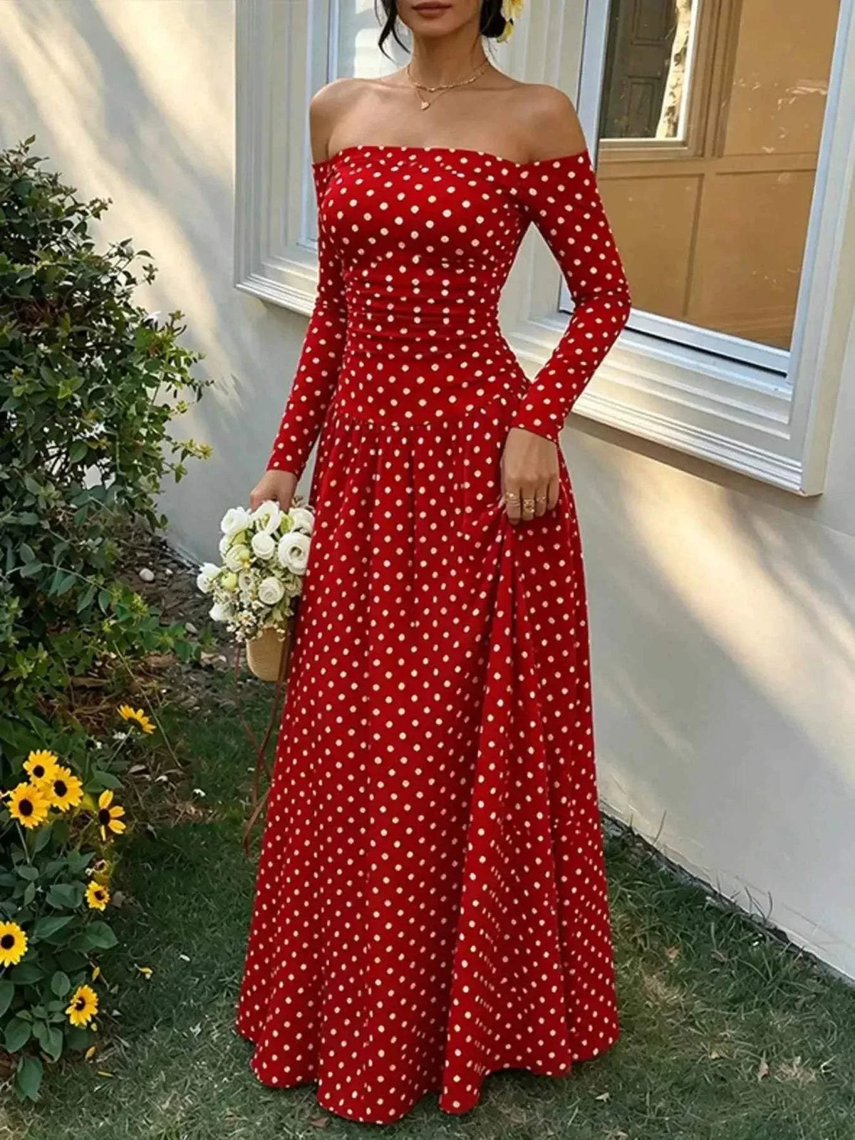 Off-the-Shoulder Maxi Dress in red with white polka dots, long sleeves, fitted bodice, and flowing full-length skirt