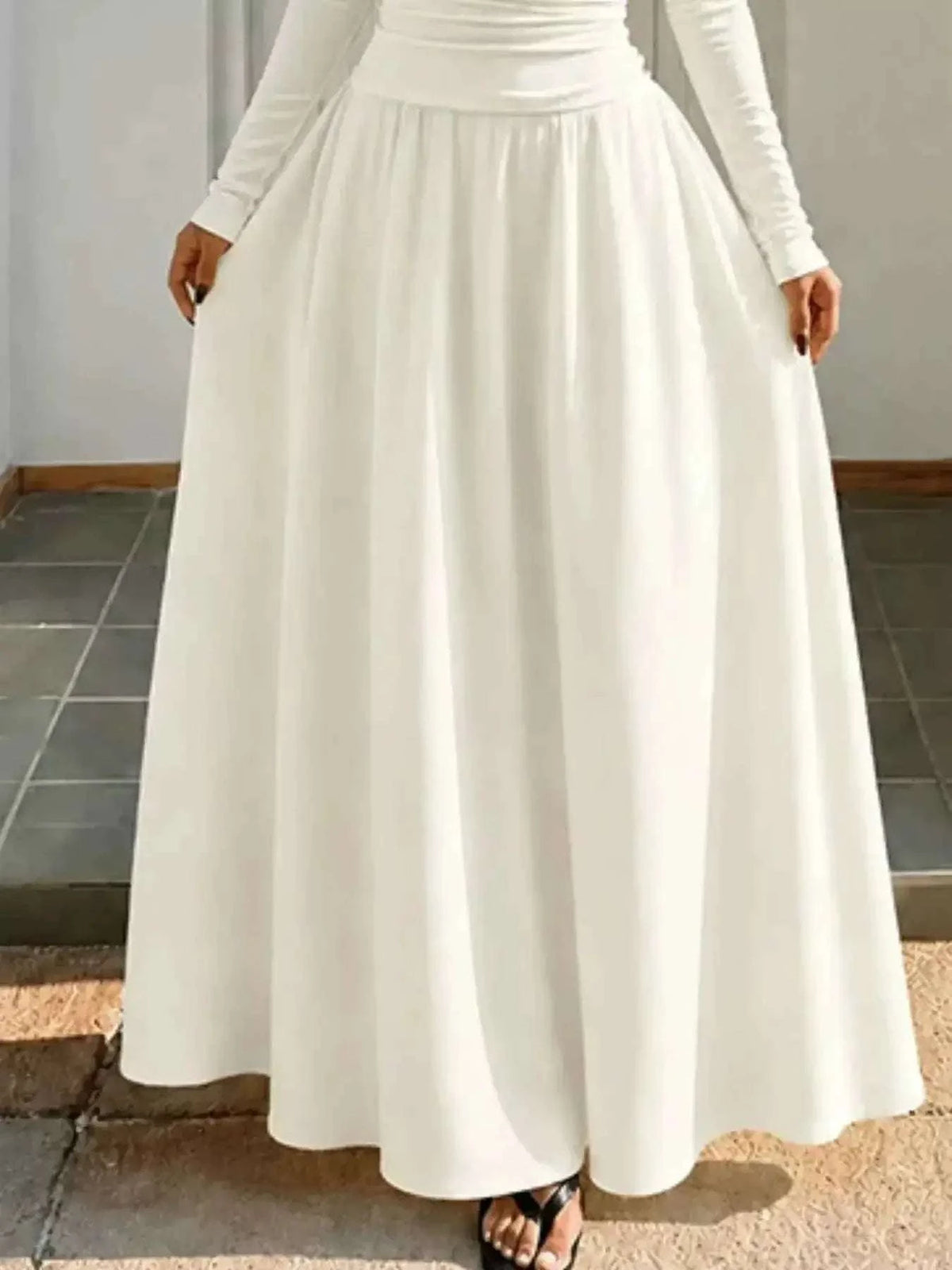 Off-the-Shoulder Maxi Dress in white with a flowing, full-length skirt and fitted long-sleeve bodice in lightweight fabric.