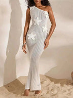 White one-shoulder crochet maxi dress with openwork pattern and floral appliques, slim fit silhouette One-Shoulder Crochet Maxi Dress.