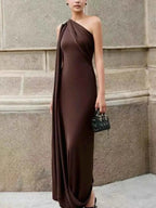 One-Shoulder Draped Maxi Dress in dark brown polyester with ruched detailing and asymmetric neckline, floor-length silhouette.