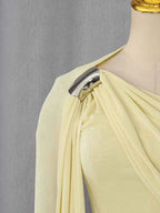 One-Shoulder Draped Maxi Dress in pale yellow polyester with ruched detailing and a silver metallic ring on the asymmetric shoulder