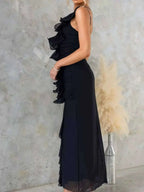 One-Shoulder Ruffle Slit Dress in black polyester featuring layered ruffles, a side slit, and a fitted waist with slight stretch.