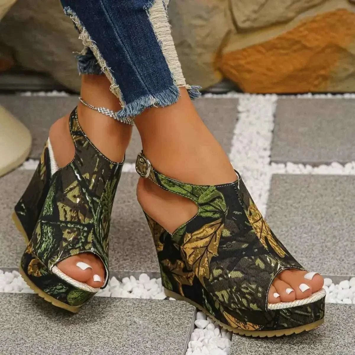 Open Toe Wedge Sandals in black with green and brown leaf pattern, high heel, and ankle strap detail